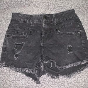 Black fringe jean shorts